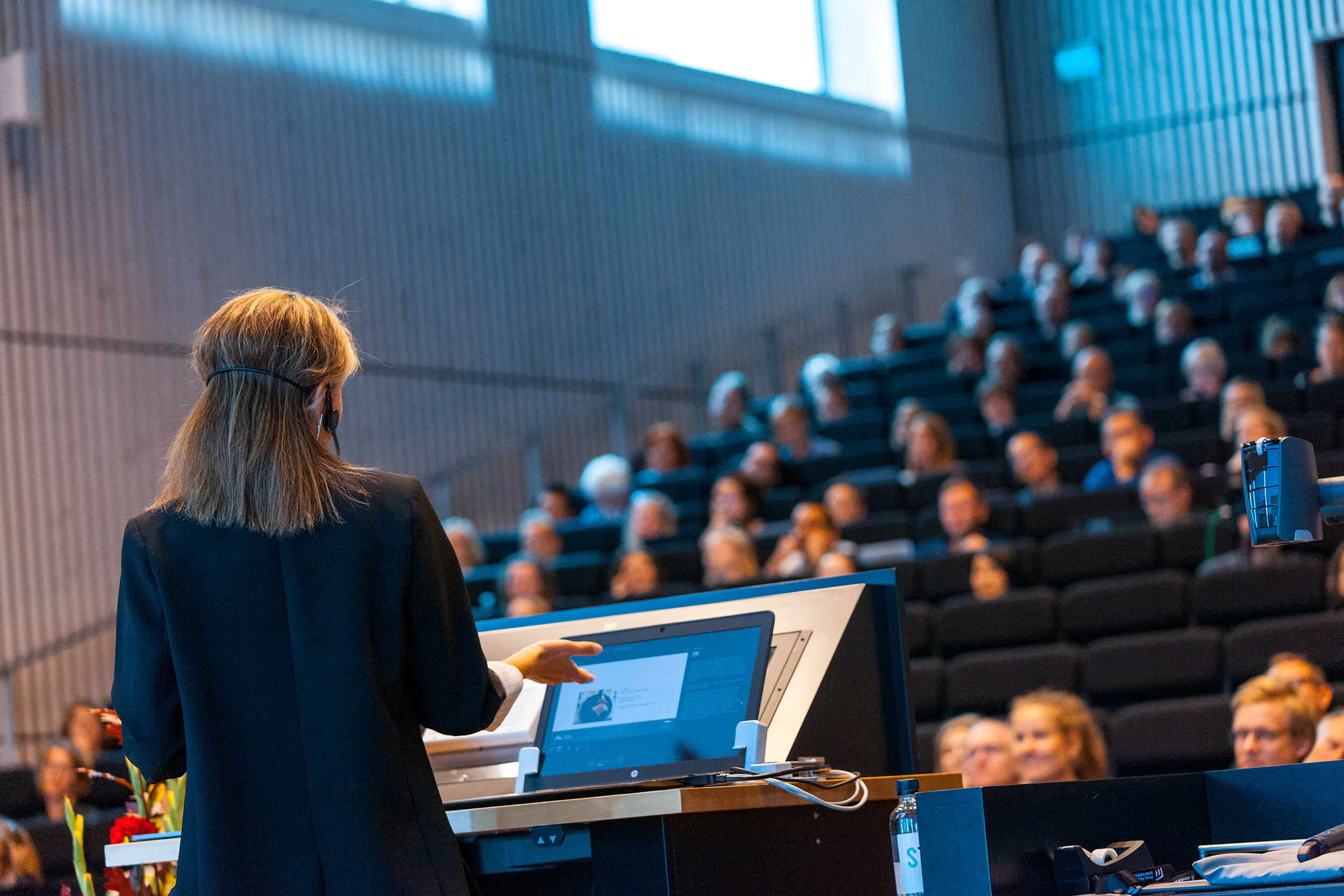 A woman standing in front of an audience at the NordMedia conference 2019.